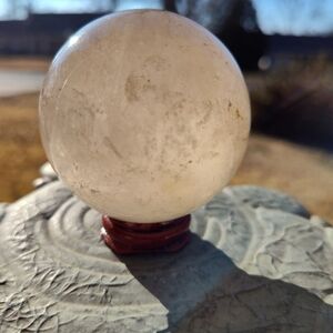 Elegant Crystal Sphere with Red Stand